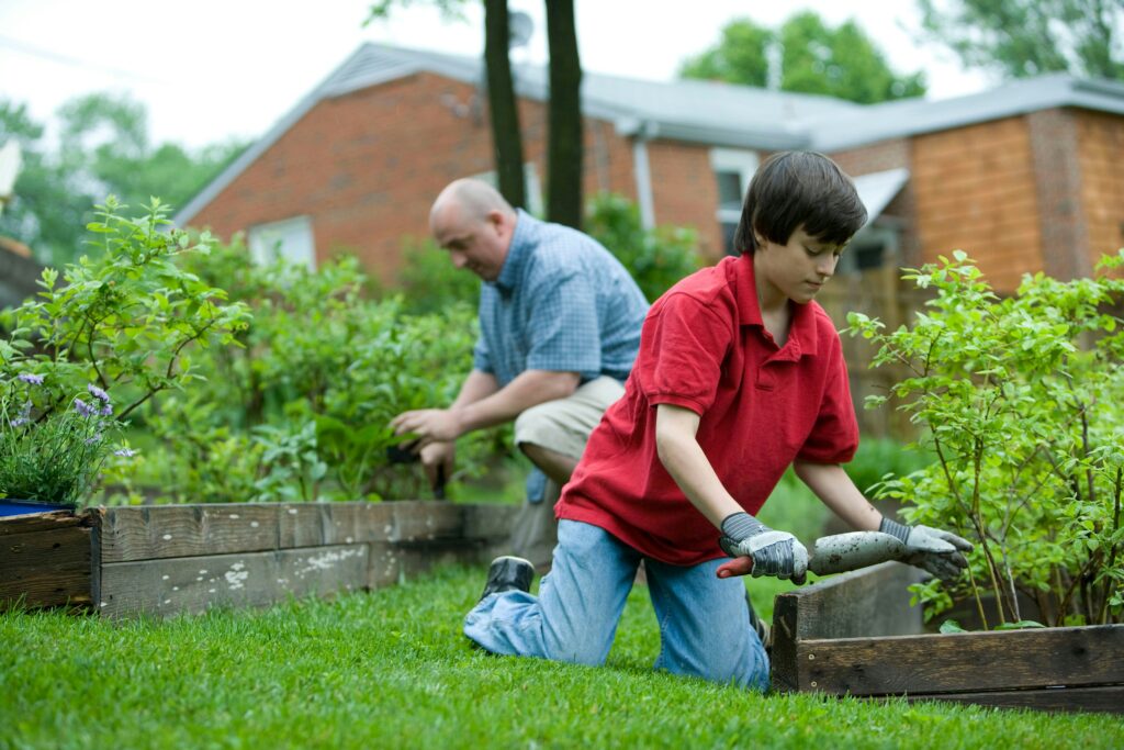 farther and son gardening